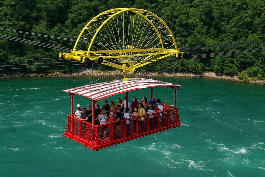 Niagara Falls, ON: Guided Tour with Boat, Skylon & Journey - Journey Behind the Falls: The Tunnels That Turn Sight Into Feeling