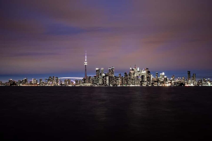 Toronto: True Tales of Toronto Harbour Audio Boat Tour - Toronto skyline at night, told through true harbour stories